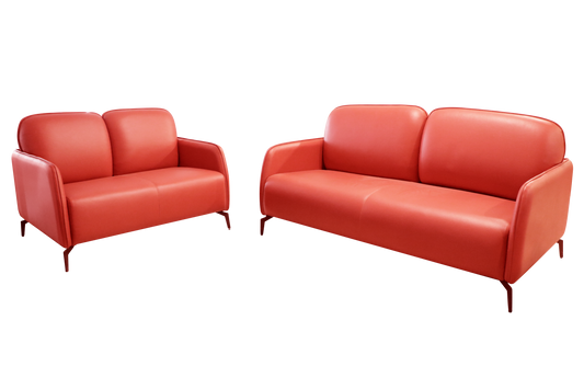  A pair of leather sofas featuring coordinated pillows and cushions, enhancing the comfort and aesthetic of the space.