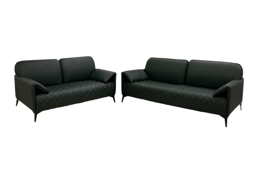 Green leather sofa featuring a stylish quilted pattern, showcasing a modern and elegant design.