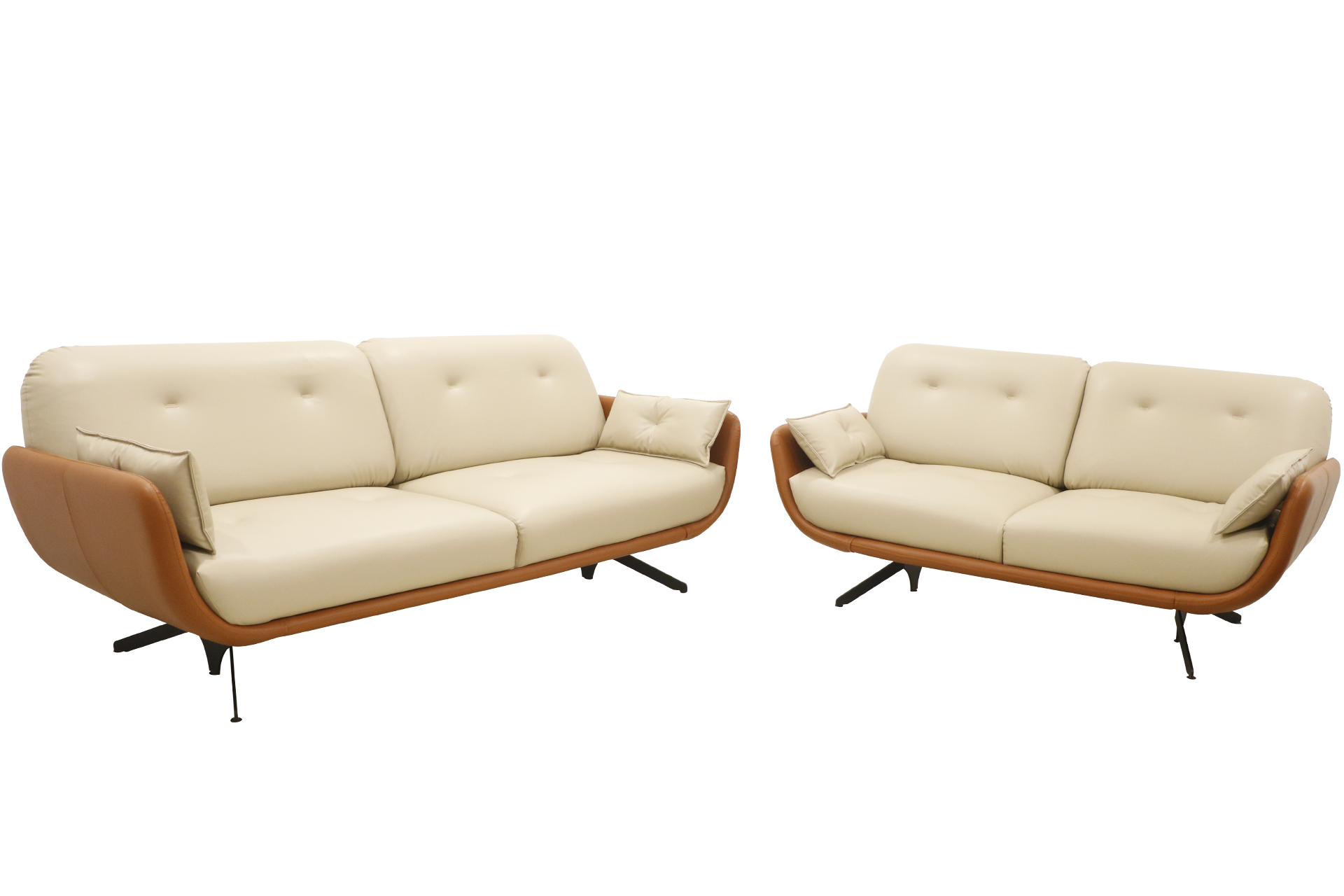 A stylish modern sofa with cream-colored cushions and a curved brown leather frame, featuring tufted backrests and angled black metal legs, isolated on a black background.
